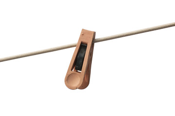 Plastic clothespin on rope isolated.
