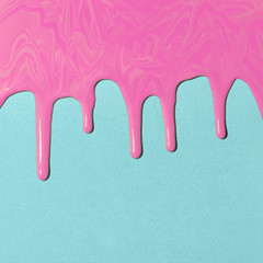 pink paint texture on blue canvas. Minimalistic background with copy space. Creative concept.