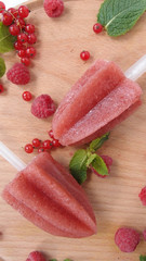 homemade juciy sorbet on a wooden background whith fresh berries and mint. top view, flat lay