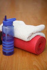 mat towel and bottle of water