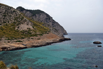 Fototapeta na wymiar Beautiful sea bay with turquoise water and mountains, Cala Figuera