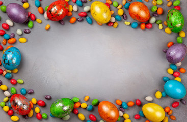 Colorful Easter eggs and chocolate Easter sweets.