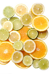 Fototapeta na wymiar slices of different citrus fruit isolated on white background