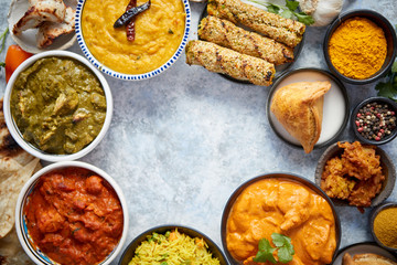 Assorted indian food on stone background. Dishes of indian cuisine