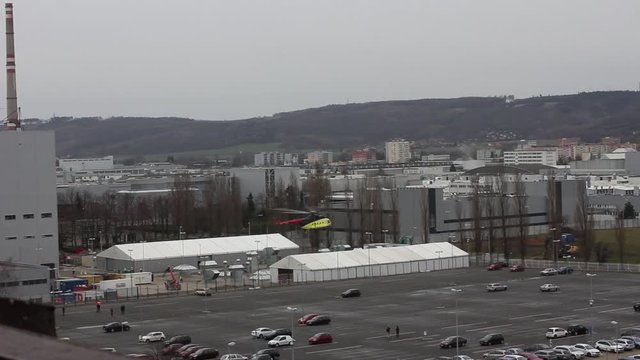 Helicopter take off and transfers cargo, Mlada Boleslav, Czech Republic.