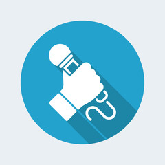 Hand holding microphone