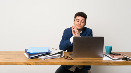 Business man in a office scheming something