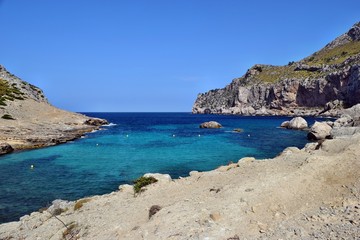 Fototapeta na wymiar Sea bay with turquoise water, beach and mountains, Cala Figuera on Cap Formentor