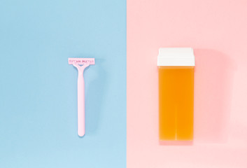 Means for hair removal on a colored background. The concept of hair removal and skin care. Minimalism, choice. Top view, flat lay.  