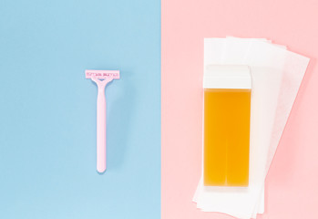 Means for hair removal on a colored background. The concept of hair removal and skin care. Minimalism, choice. Top view, flat lay.  