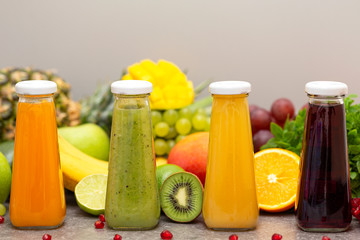 Assortment of fruit and vegetables smoothies in glass bottles. Fresh organic Smoothie ingredients....