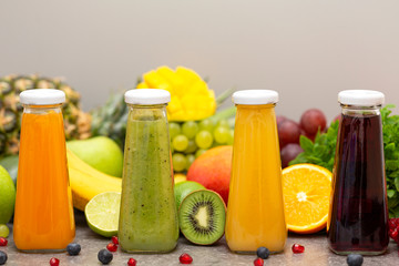 Assortment of fruit and vegetables smoothies in glass bottles. Fresh organic Smoothie ingredients. Detox, dieting or healthy food concept. Vegetarian food.
