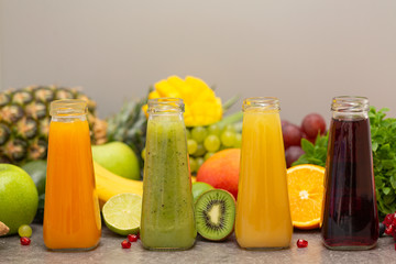 Assortment of fruit and vegetables smoothies in glass bottles. Fresh organic Smoothie ingredients....