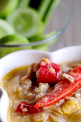 Herb Soya Beans with Minced Shrimp and Pork in Coconut Milk and chili in white bowl served with Fresh Vegetables, special recipe well decorate Thai tradition food sold in restaurant and market