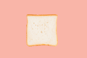 Single slice of toast bread isolated on pink background