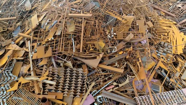 Low altitude aerial flight over scrap metal recyclable materials left over from product manufacturing and consumption the more frequently recycled metals are steel iron lead aluminium copper and zinc