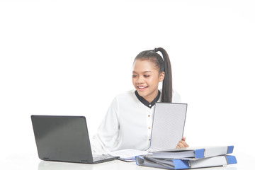 Office lady in white shirt and ponytail hair using a laptop and file