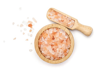 Lot of pieces of pink himalayan salt crystals in a scoop flatlay isolated on white background
