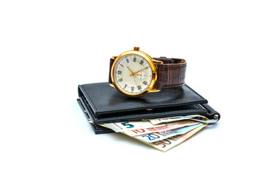 Photograph, isolate on a white background - wallet, banknotes of 50 euros, a wrist men's watch.