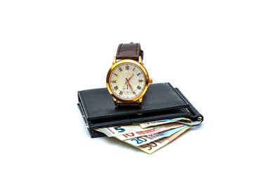 Photograph, isolate on a white background - wallet, banknotes of 50 euros, a wrist men's watch.