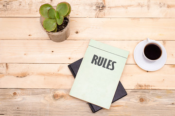  Law book with Rules word on wooden table