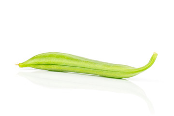One whole edible green sugar snap pea isolated on white background