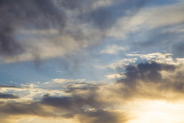 Bright blue sky with gentle cumulus clouds. Pink vanilla heaven. Natural summer and spring background.