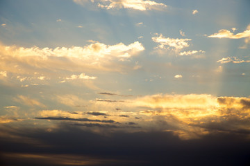 Bright blue sky with gentle cumulus clouds. Pink vanilla heaven. Natural summer and spring background.