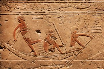 People on riverboat, relief on ancient Tomb of Sakkara, made at 2300 BC in Egypt, saved by...