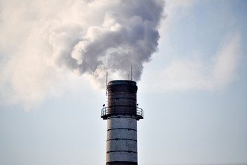 Industrial smoke from a chimney against the sky