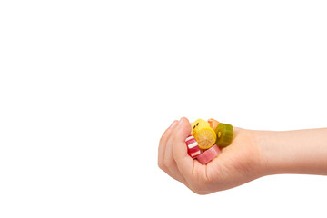 Kids hand with colored round candy, sugar lollipop