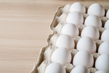 Many white chicken eggs food in tray box 