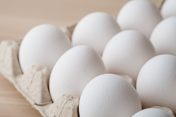 Many white chicken eggs food in tray box 