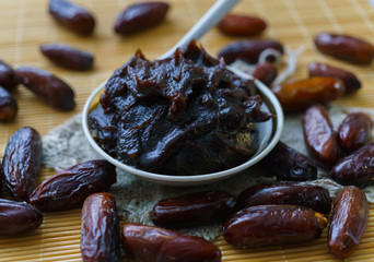 Raw Organic Fresh dates together with fint jam from dates .