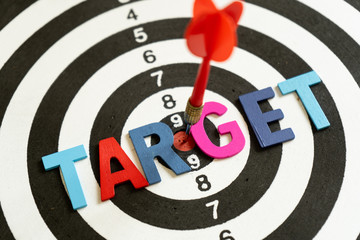 Red dart hits in the center of a target isolate on white background
