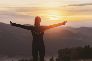 Fototapeta premium Sport lifestyle concept, Young sporty woman resting after running at the sunset