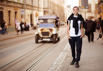 Young traveler man walk alone by old europen street