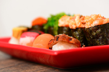 Tasty sushi on ceramic plate