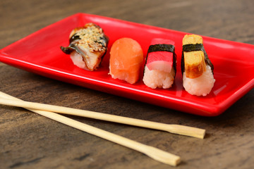 Bamboo chopsticks and plate with sushi