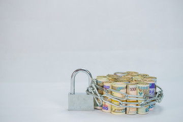 Bundles of naira cash chained and padlock concept of Esecurity