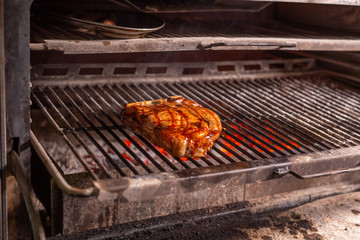 food, craft and delicious concept - cooking steak on a grill