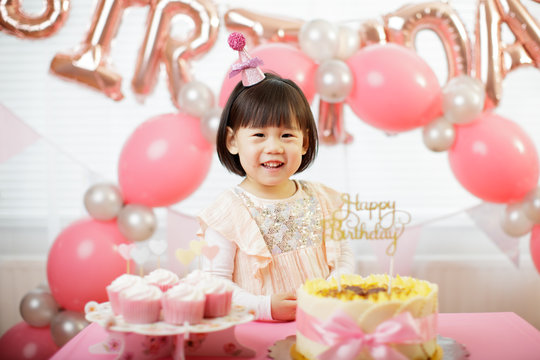 toddler girl celebrating her third birthday at home