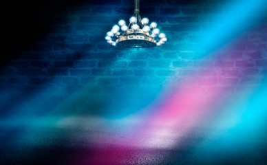 Empty scene background. Empty room with burning antique chandelier. Neon light smoke