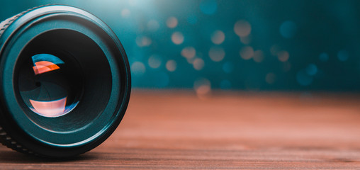 Photo lens on dark background. Copy space for text or design
