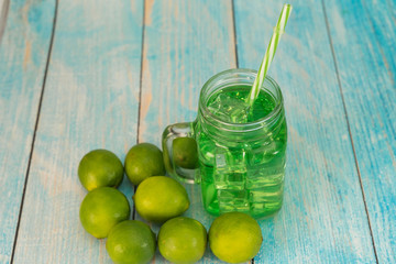 Lemonade summer cold drink with wooden background