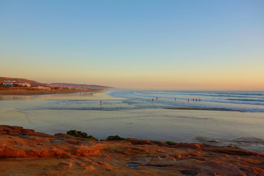 Sunrise over coastal village Taghazout in Southern Morocco known as surfing paradise near to Agadir