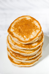 stack of delicious pancakes on a plate, vertical top view