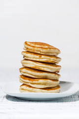 stack of delicious pancakes on a plate, vertical