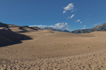 Fototapeta na wymiar hiking across sand dunes in Great Sand Dunes National Park and Preserve (Saguache county, Colorado, USA)