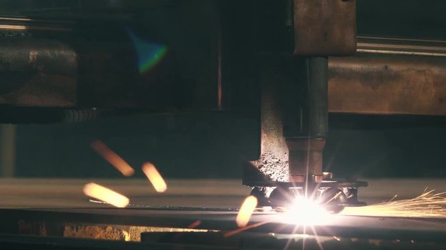 Close-up Laser Cutting Machine Cuts A Sheet Of Metal
